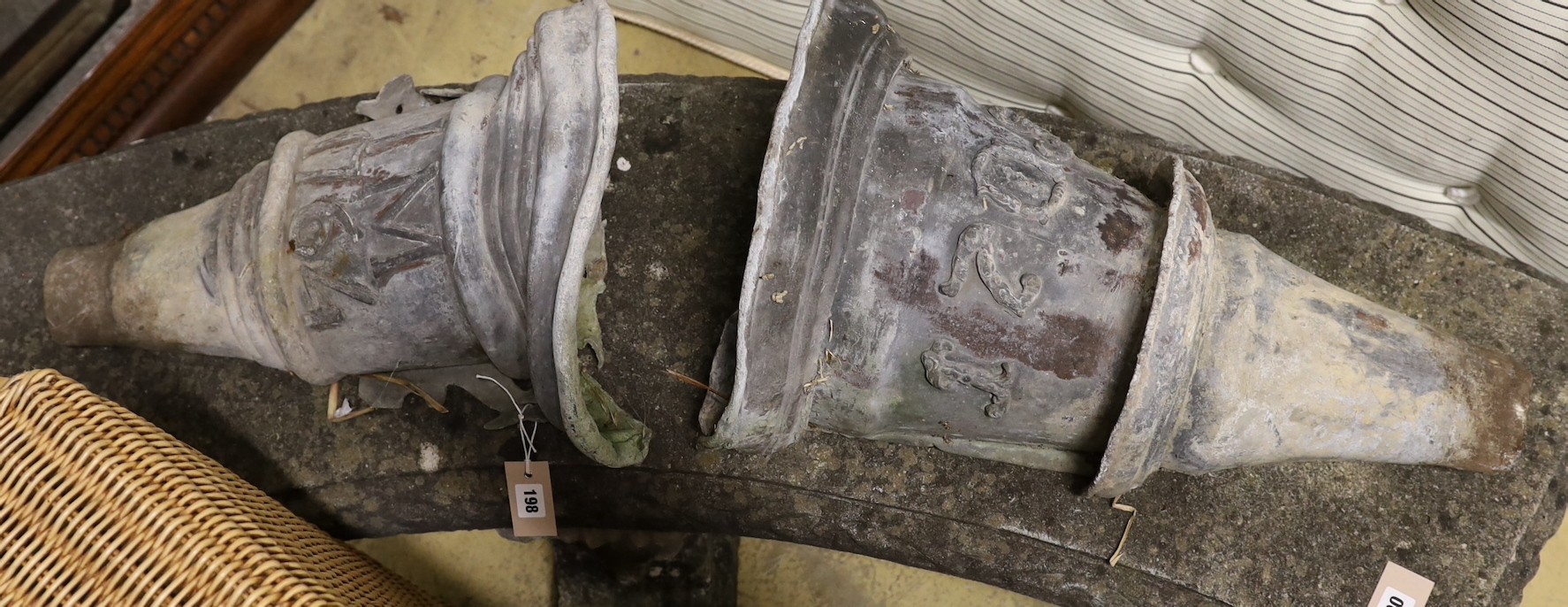 Two 18th century lead rain hoppers, one dated 1709, the other 1764 and initialled I M, larger height 59cm